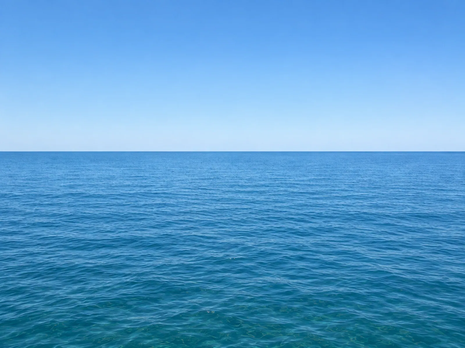 The “Clear sky open water” background on its own, with no vehicle.