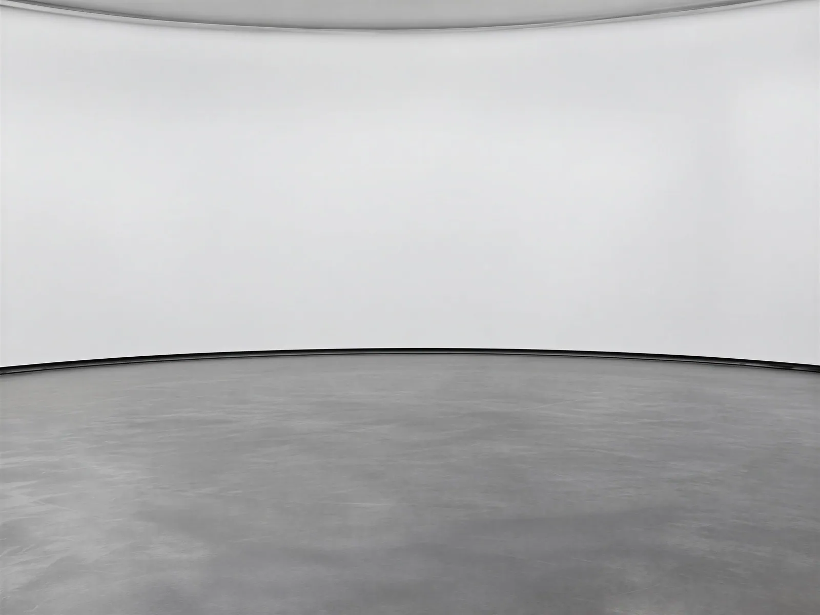 The “White backdrop, dark grey floor” background on its own, with no vehicle.