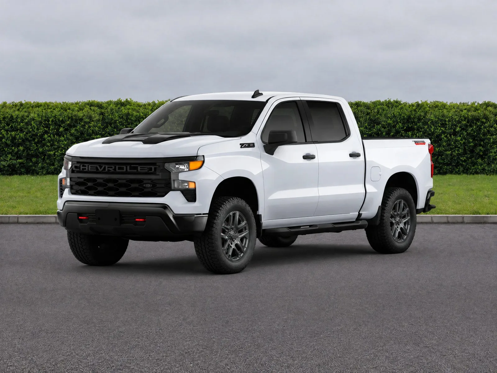 Pickup truck on the “Hedge, lawn and roadway” background.